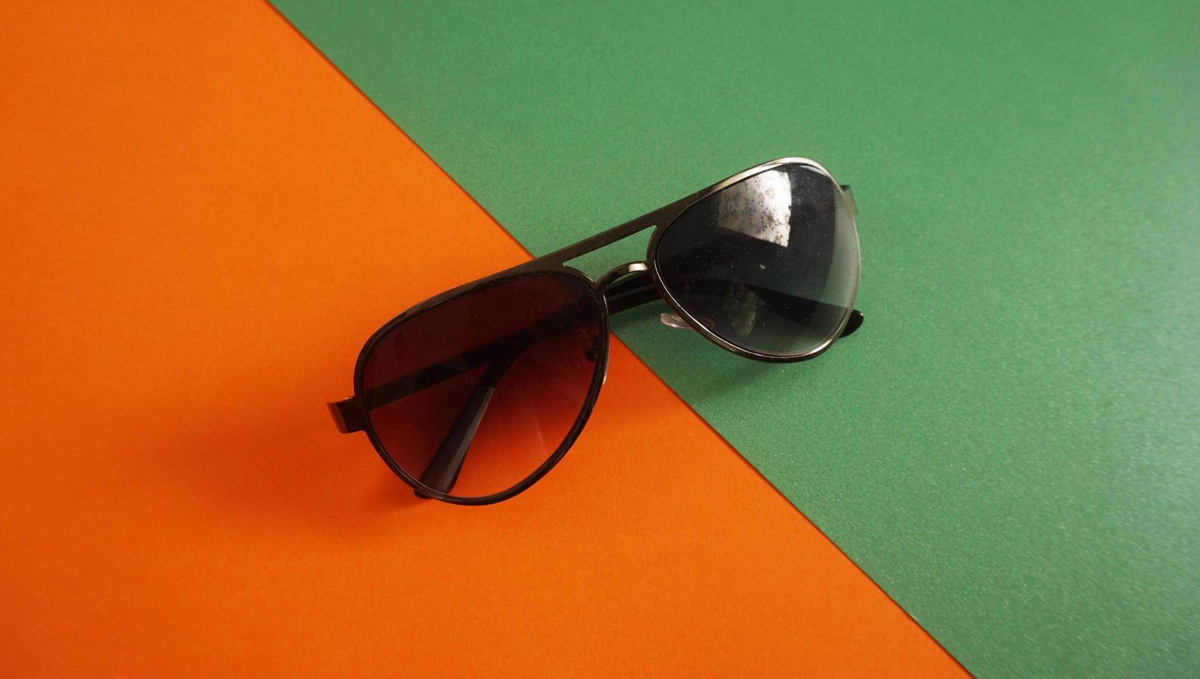 Sunglasses isolated color and light background photo