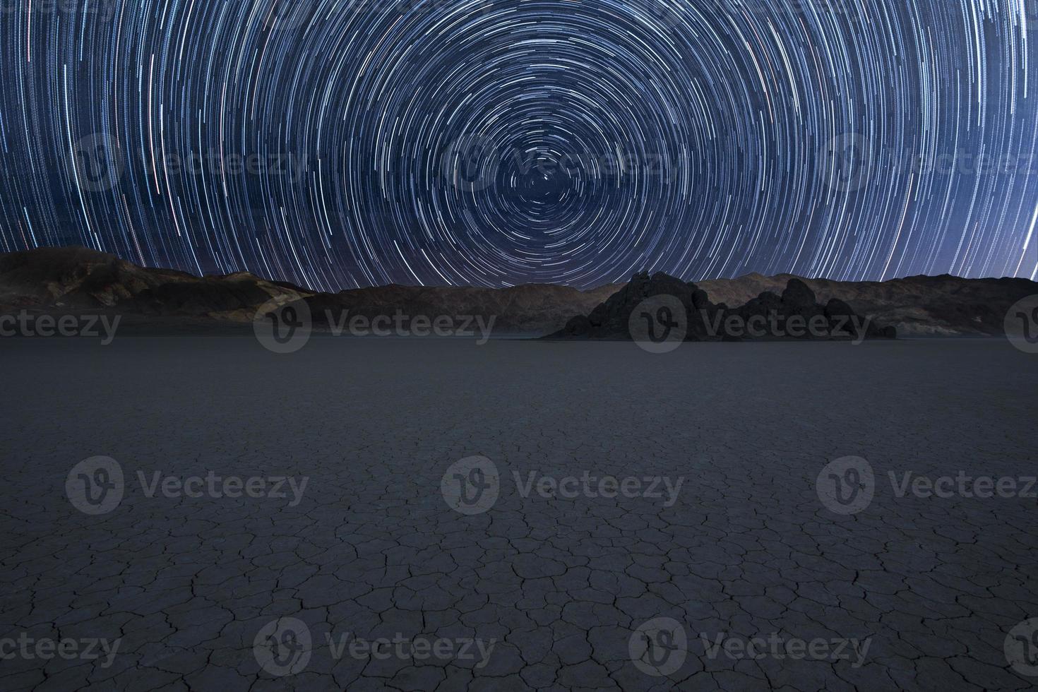 Star trail over Race Track in Death Valley National Park, USA photo