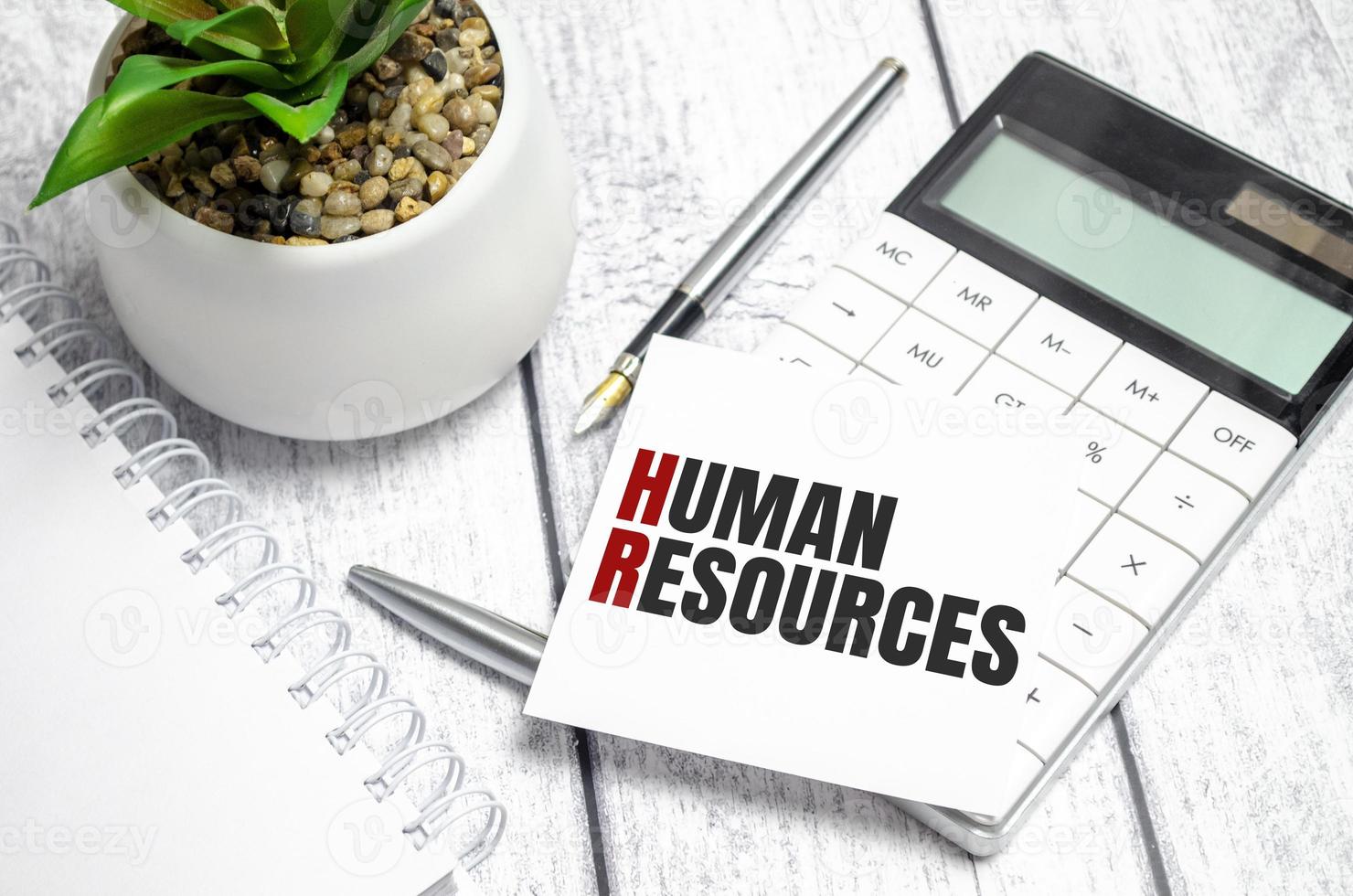 human resources text on sticker with calculator, glasses and magnifier photo