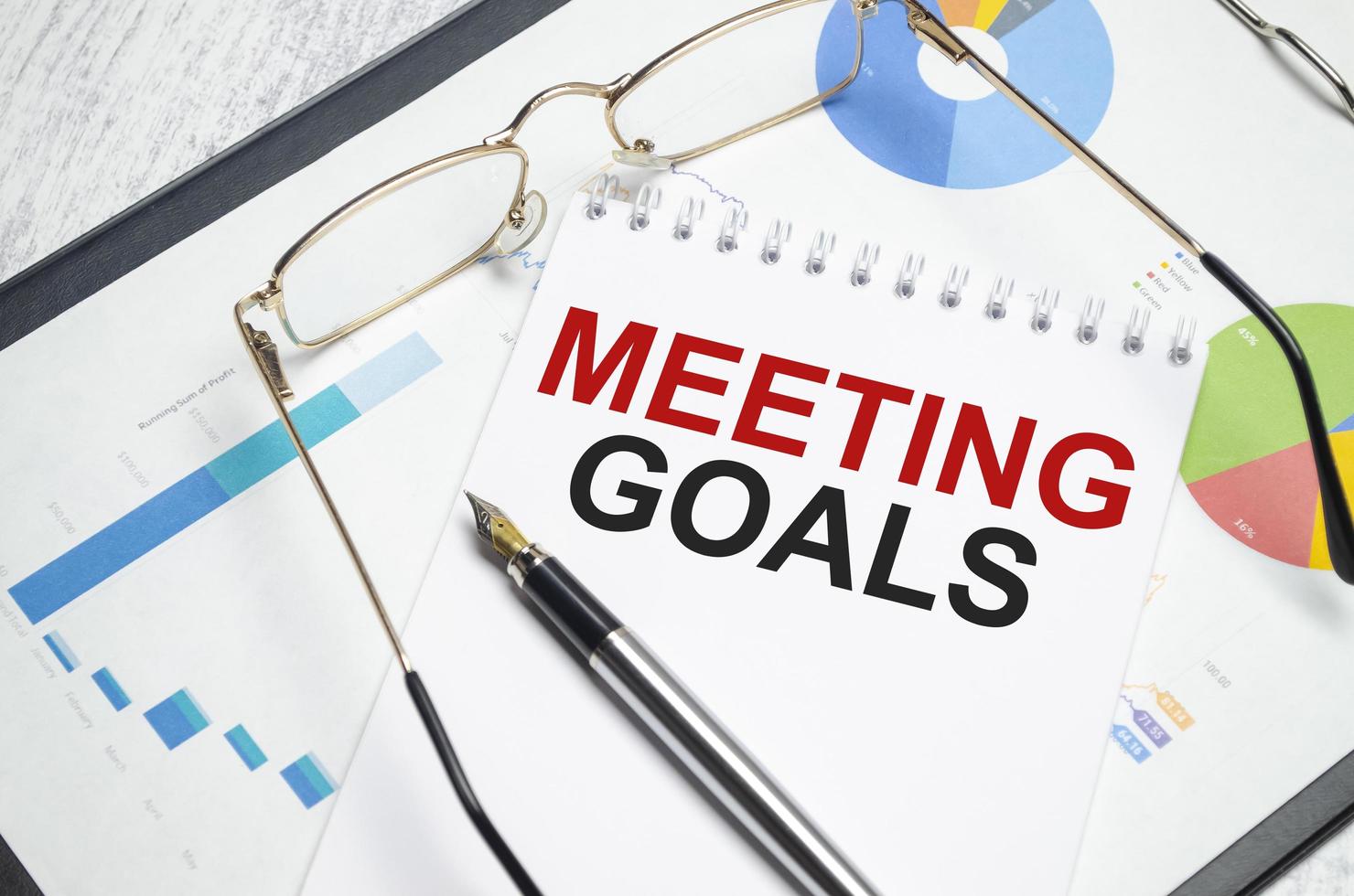 Notebook with Tools and Notes with text MEETING GOALS photo