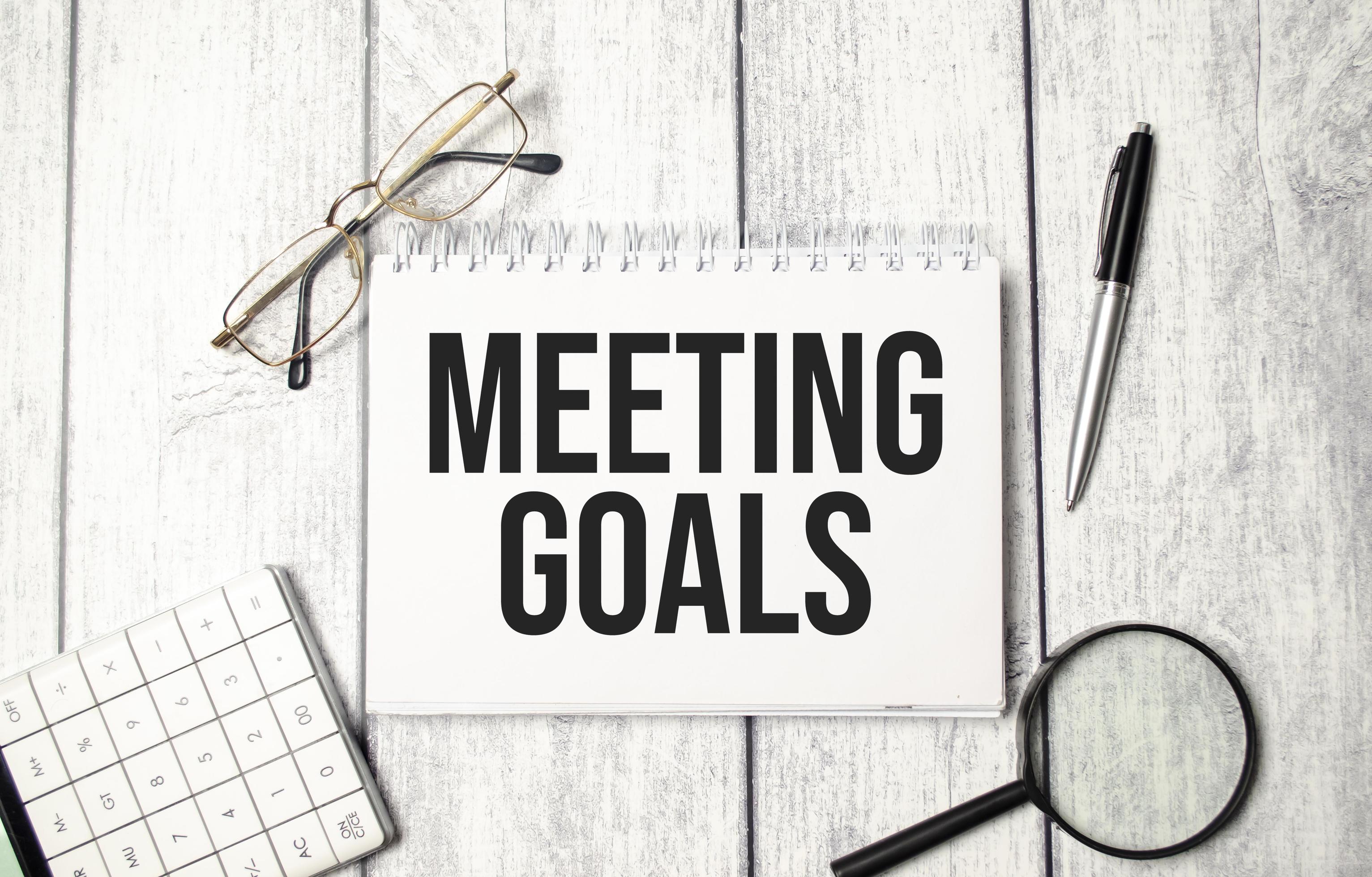 MEETING GOALS word on notebook and calculator 8623482 Stock Photo at