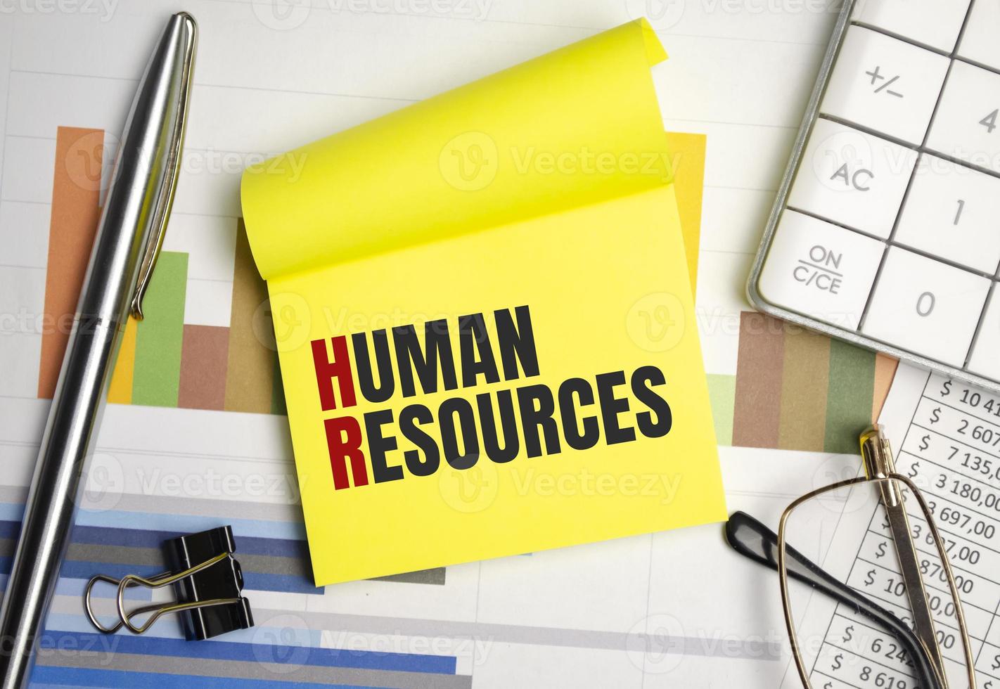 yellow sticker with the text human resources and charts photo