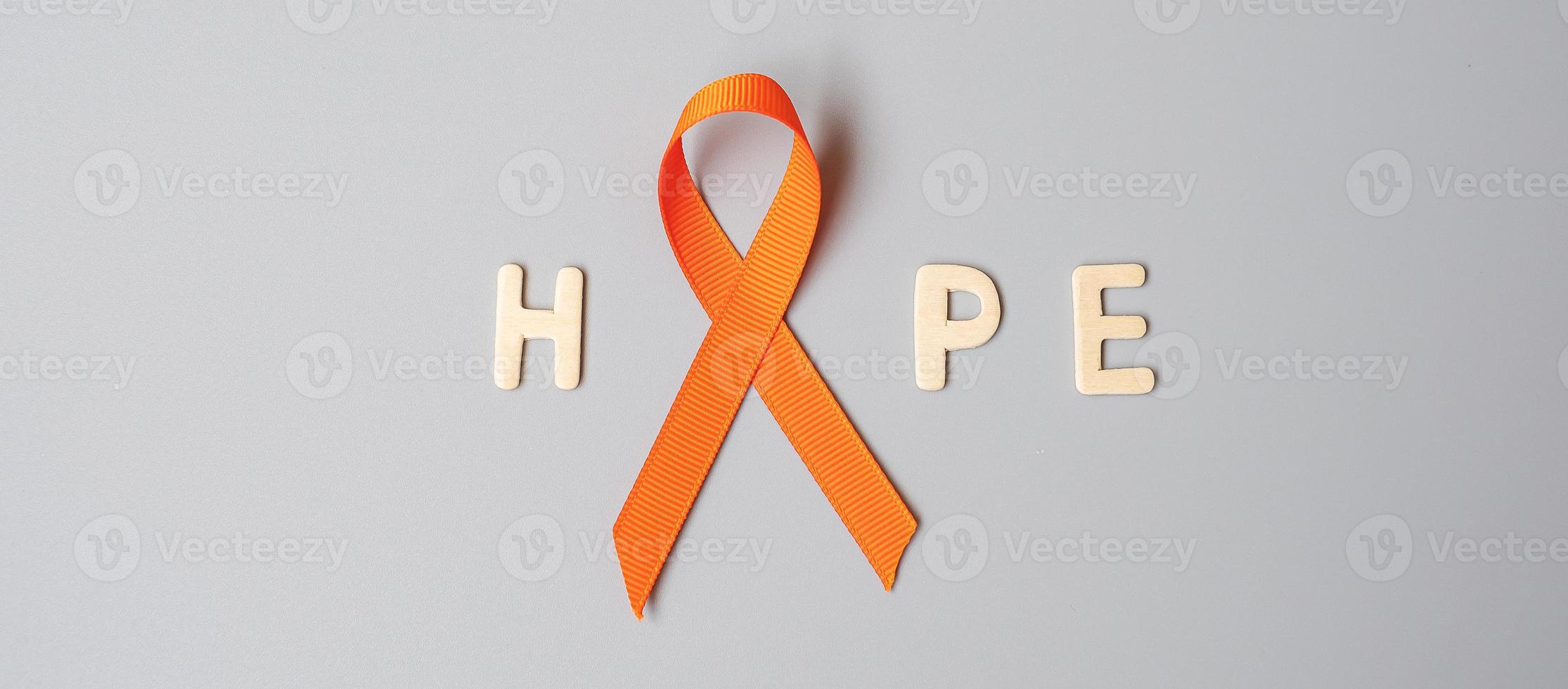 Leukemia, Kidney cancer day, world Multiple Sclerosis, CRPS, Self Injury Awareness month, Orange Ribbon for supporting people living and illness. Healthcare and World cancer day concept photo