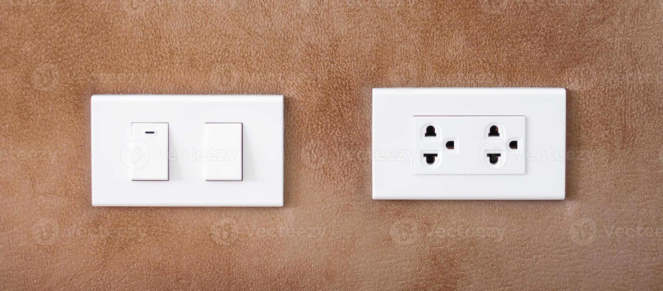 light switch on wall at home. Energy Saving, power, electrical and lifestyle concepts photo