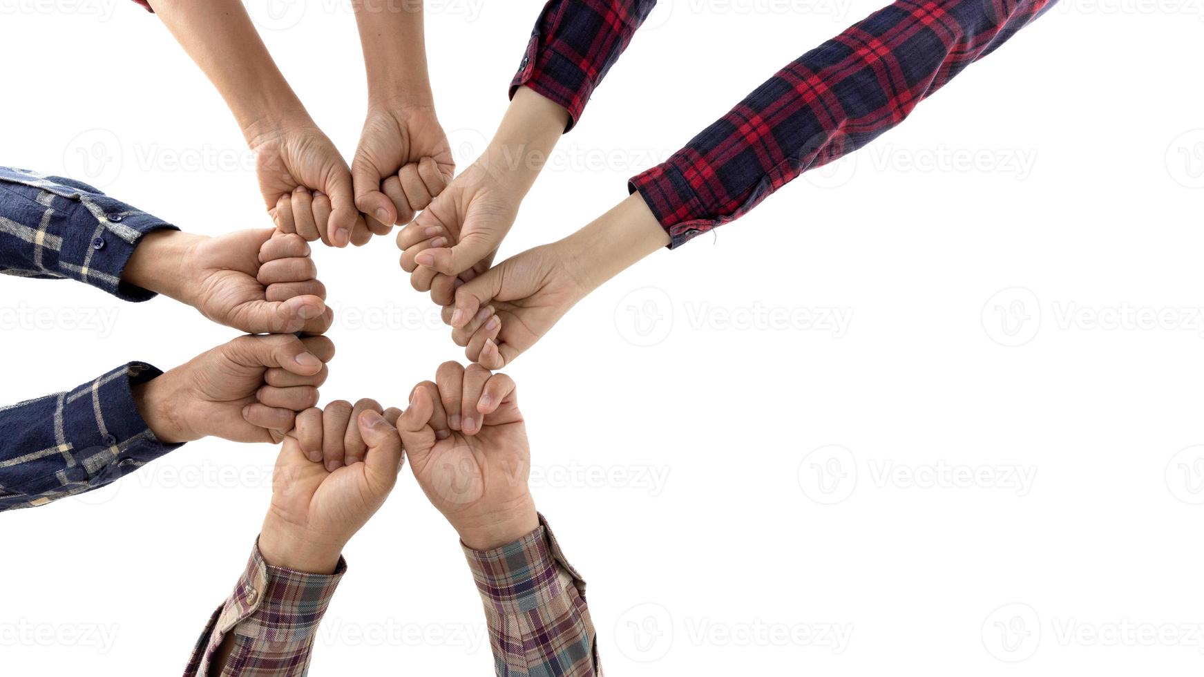 Business team reaching out to each other isolated on white background. Business teamwork come hand in hand concept, people join for the success of business cooperation. photo