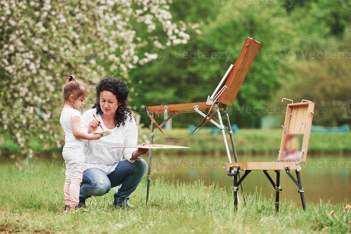You need to be patient for this. Teaching granddaughter how to paint. In the natural parkland photo