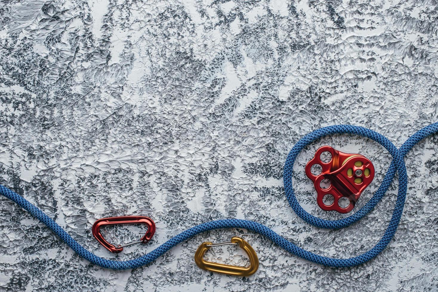 Waiting for customer to buy it. Isolated photo of climbing equipment. Part of carabiner lying on the white and grey colored table