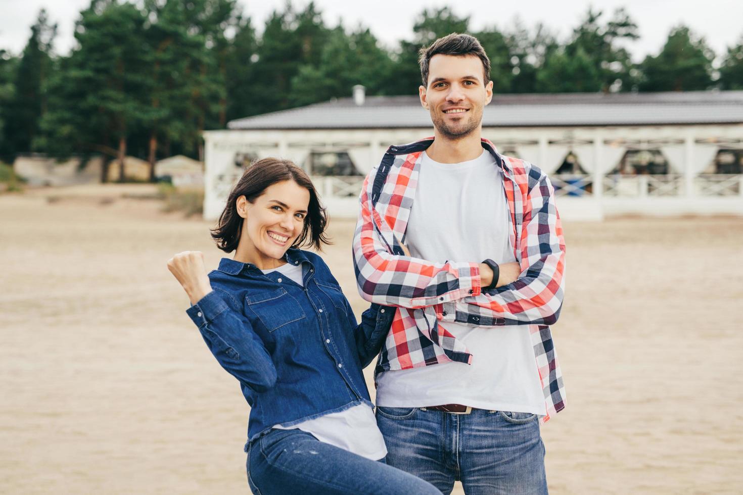 Woman and man pose outdoor photo