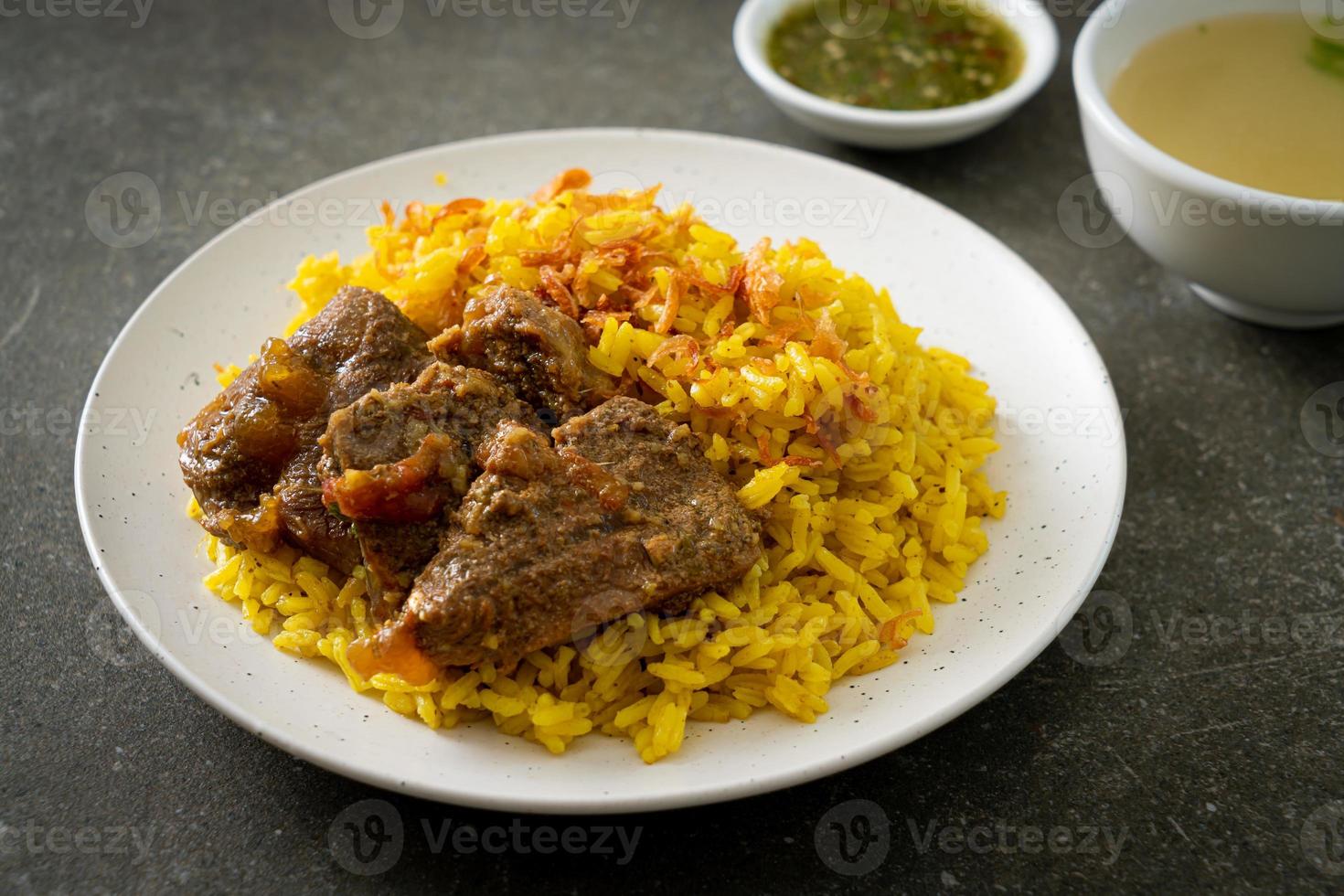 Beef Biryani or Curried rice and beef - Thai-Muslim version of Indian biryani, with fragrant yellow rice and beef photo