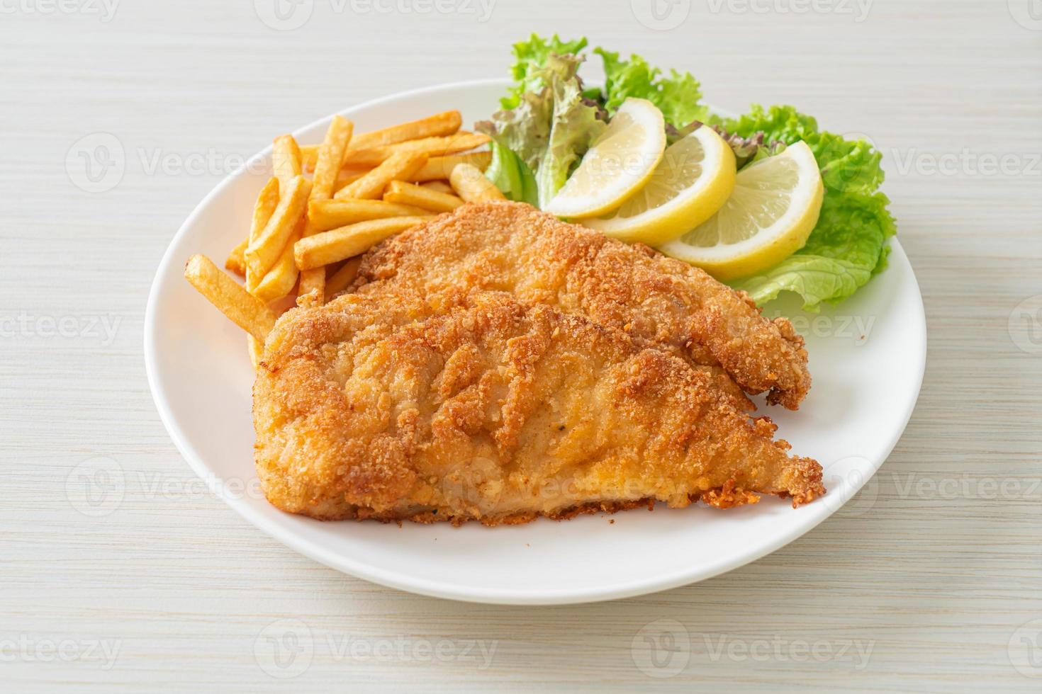 Homemade Breaded Weiner Schnitzel with Potato Chips photo