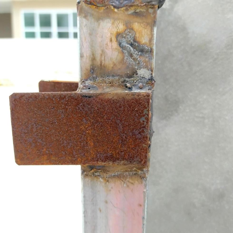 Installation of fence gates at construction sites. Area of rust. photo