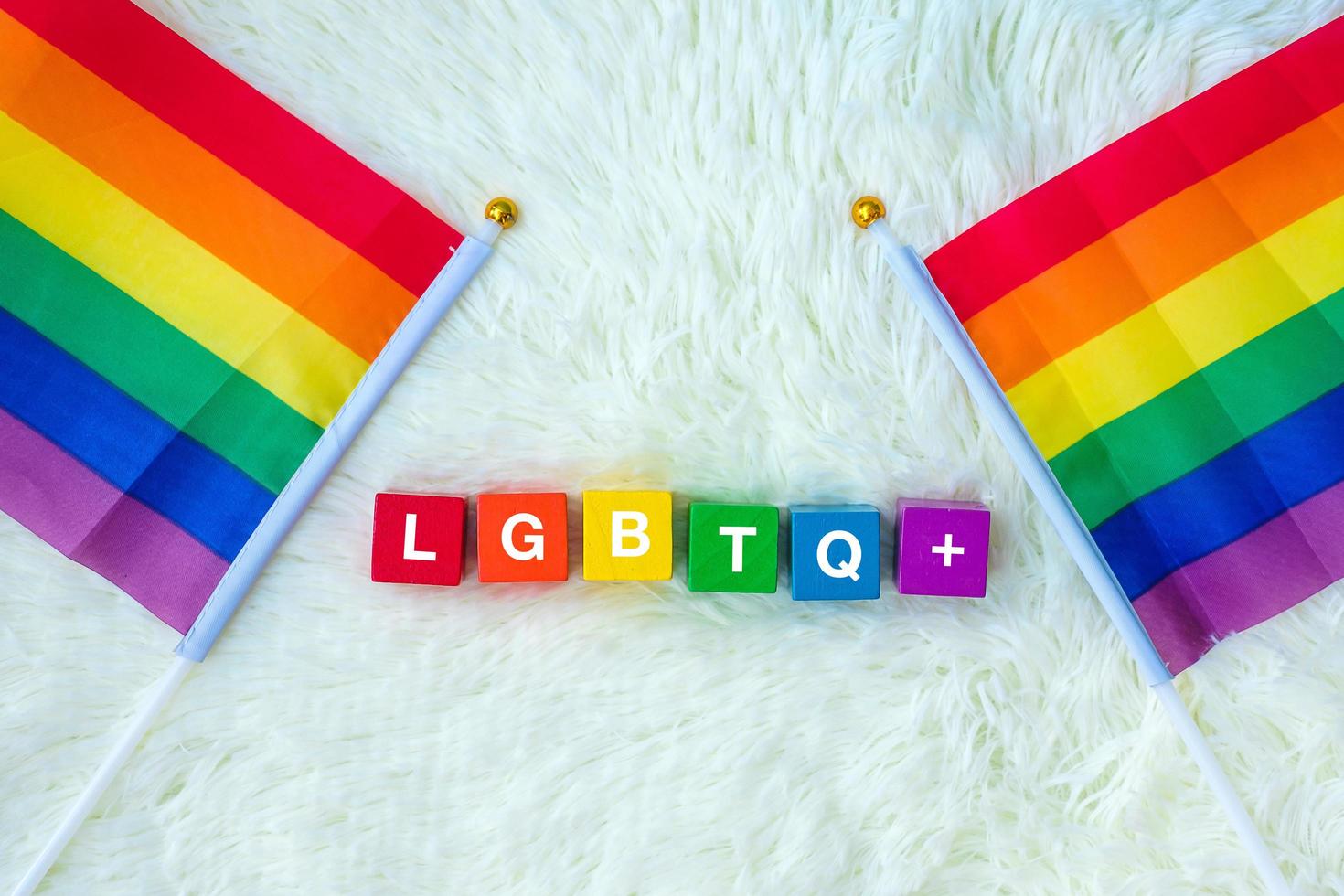 LGBTQ Rainbow flag on white background. Support Lesbian, Gay, Bisexual, Transgender and Queer community and Pride month concept photo