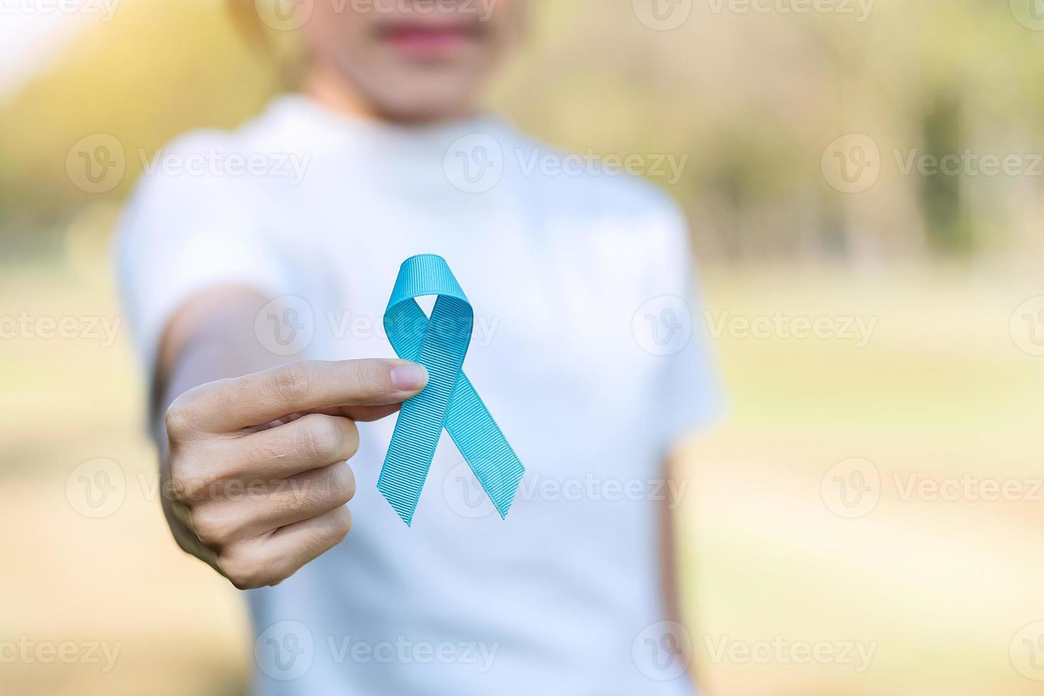 November Prostate Cancer Awareness month, woman holding Blue Ribbon for supporting people living and illness. Healthcare, International men, Father, World cancer day and world diabetes day concept photo