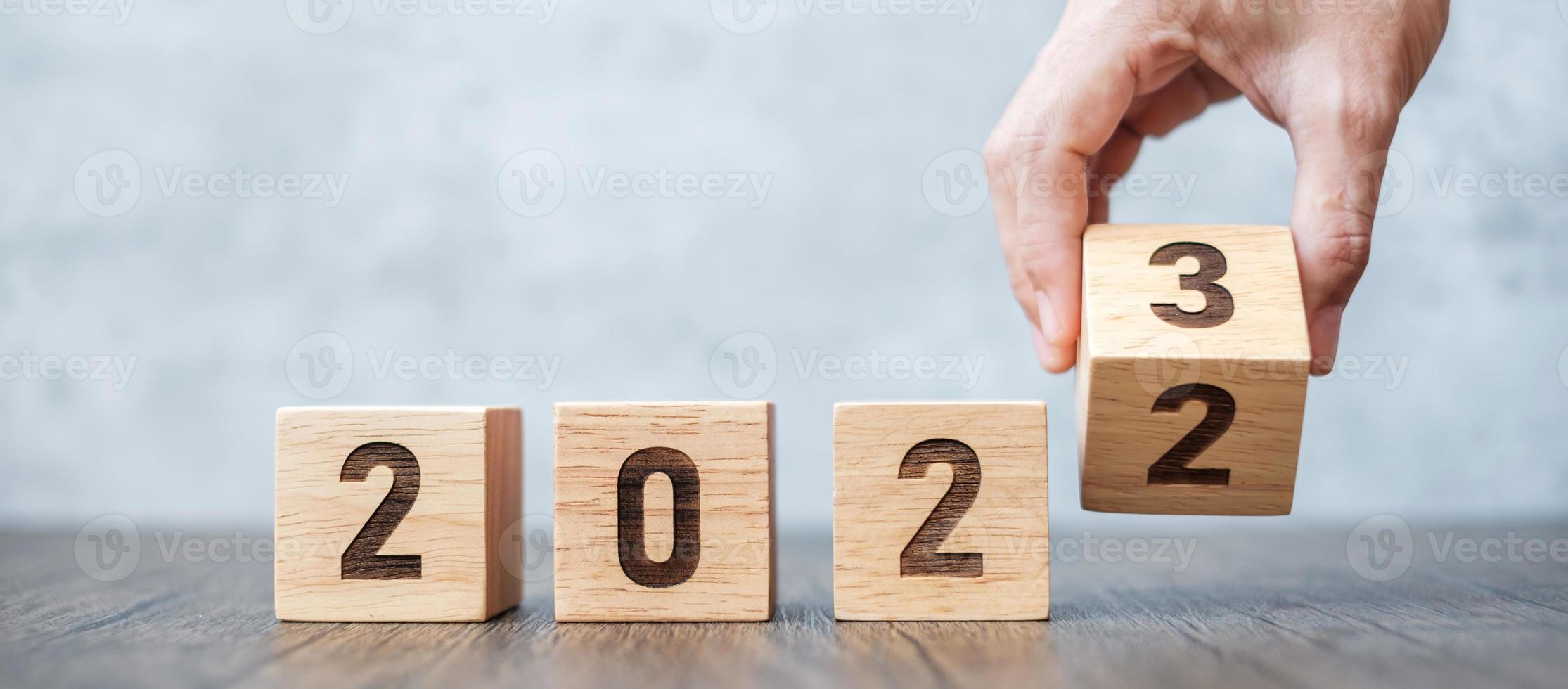 hand flip 2022 to 2023 block. goal, Resolution, strategy, plan,, motivation, reboot, forecast, change, countdown and New Year holiday concepts photo