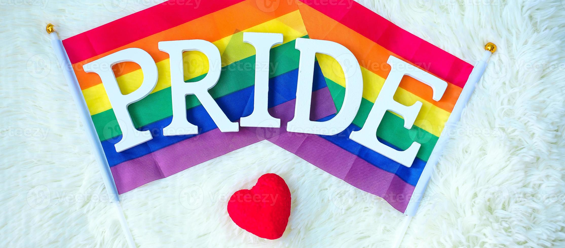 LGBTQ Rainbow flag on white background. Support Lesbian, Gay, Bisexual, Transgender and Queer community and Pride month concept photo