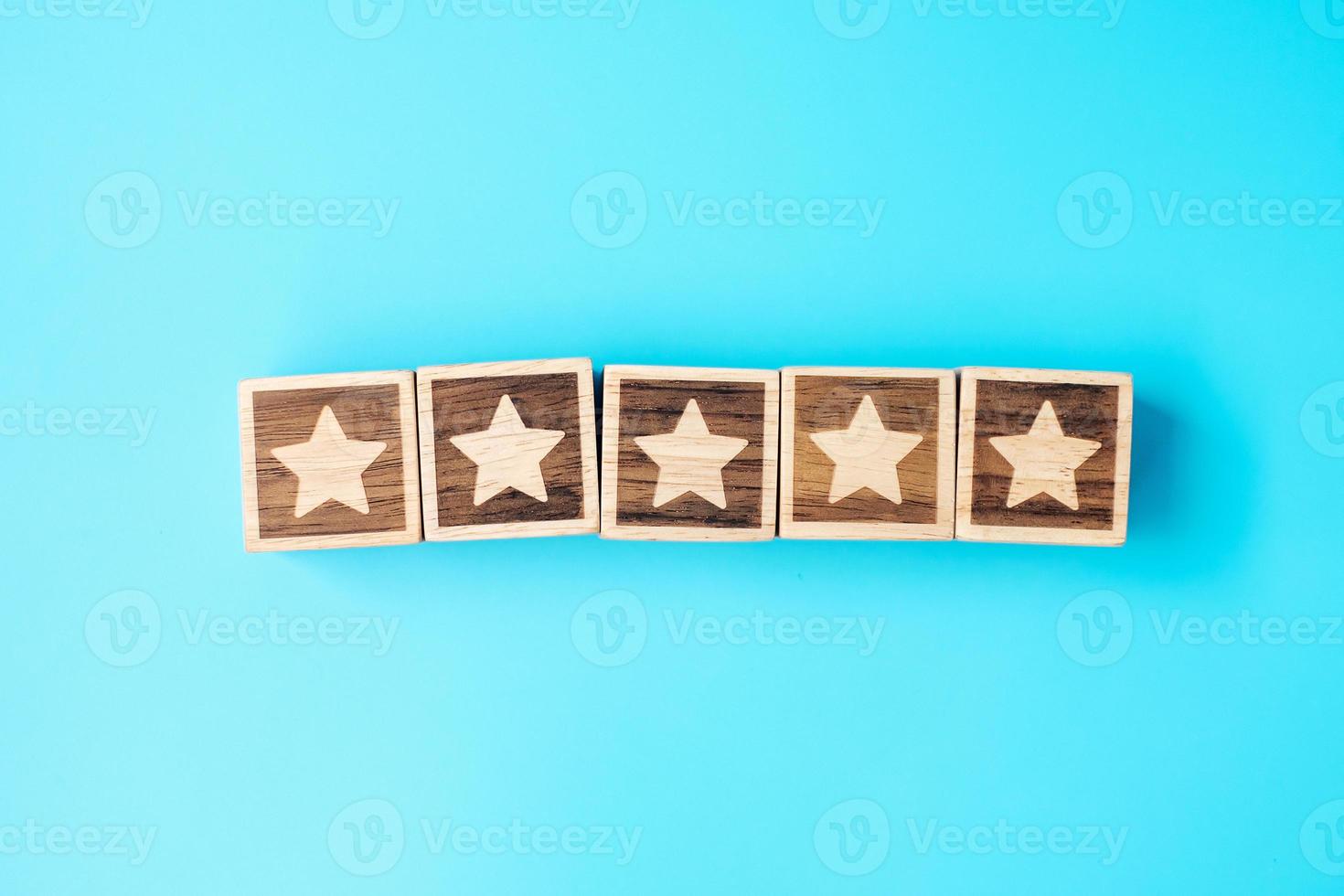 star symbol block on blue background. Service rating, ranking, customer review, satisfaction, evaluation and feedback concept photo