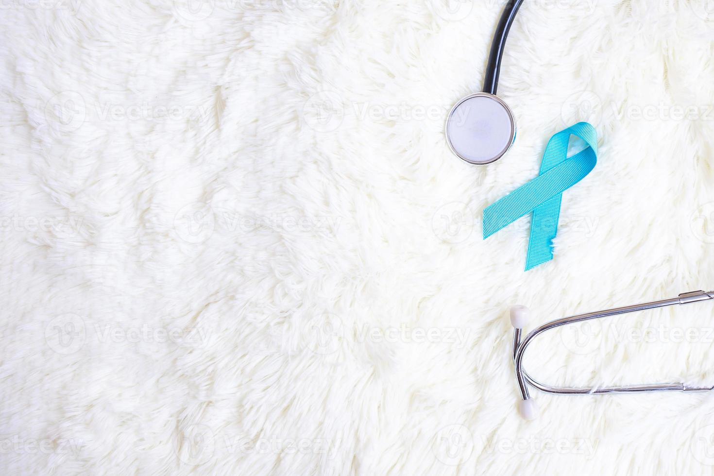 November Prostate Cancer Awareness, light Blue Ribbon with stethoscope for supporting people living and illness. Diabetes day, International men and World cancer day concept photo