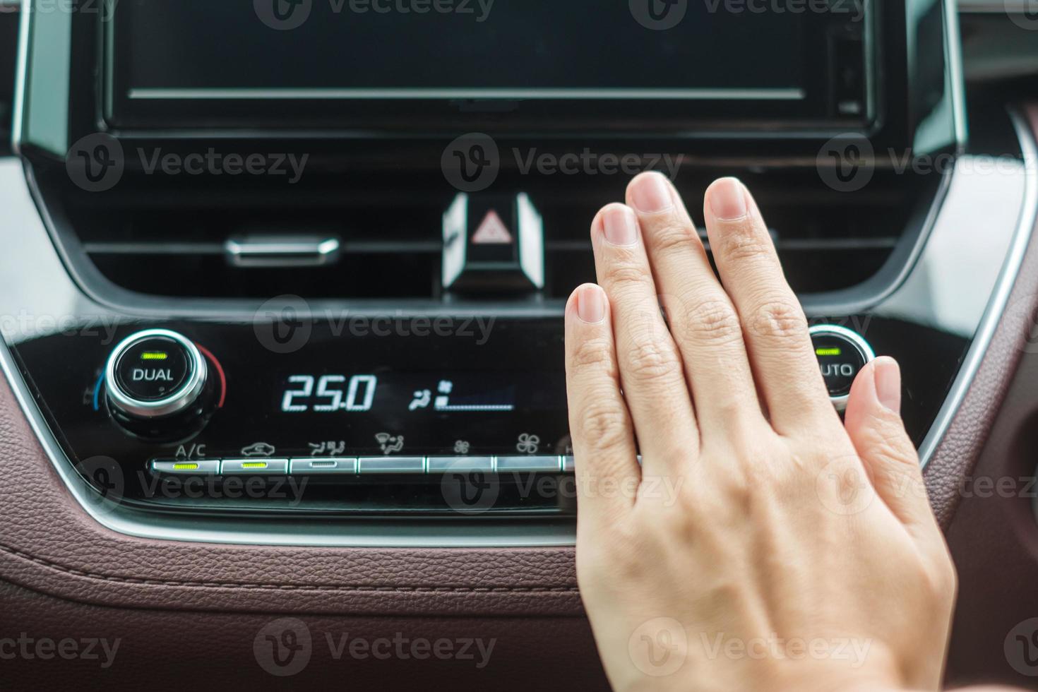 Woman hand checking the air flowing during driving car on the road, air conditioner cooling system inside the car. Adjust, temperature and transport concept photo