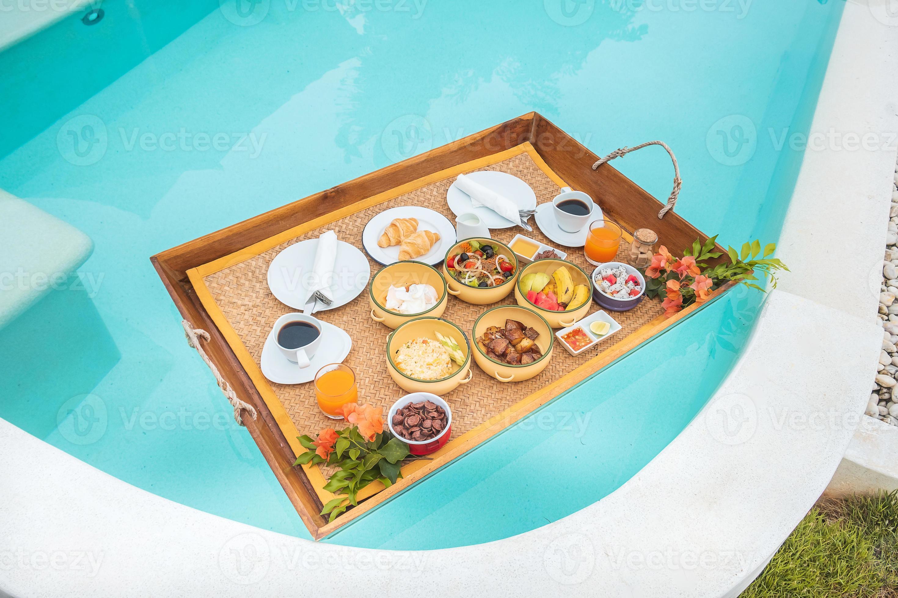 Floating Breakfast tray in swimming pool at luxury hotel or tropical
