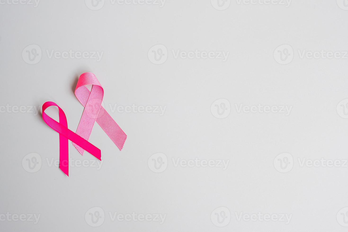 October Breast Cancer Awareness month, Pink Ribbon on grey background for supporting people living and illness. International Women, Mother and World cancer day concept photo