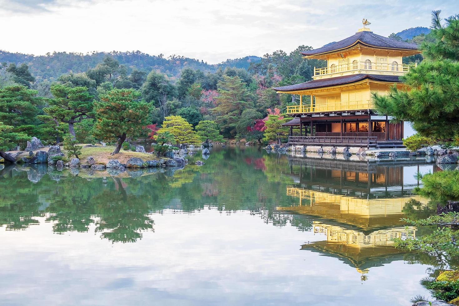 Beautiful of Kinkakuji temple or the golden Pavilion in Autumn foliage season, landmark and famous for tourist attractions in Kyoto, Kansai, Japan photo