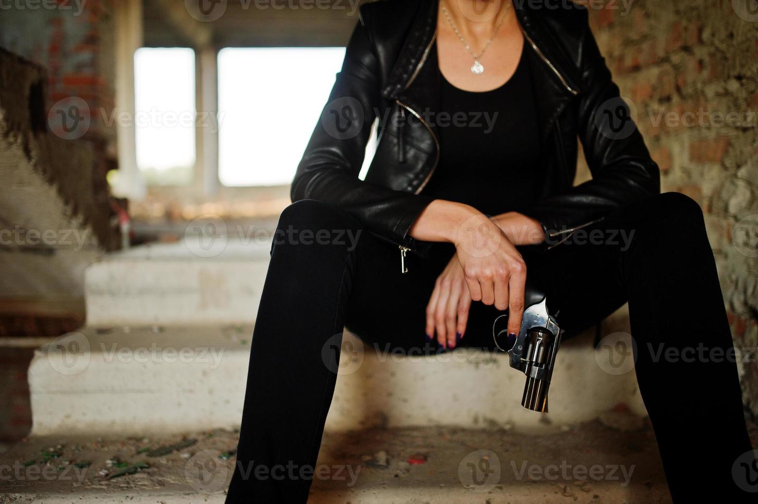 Sexy FBI female agent at abadoned place. photo