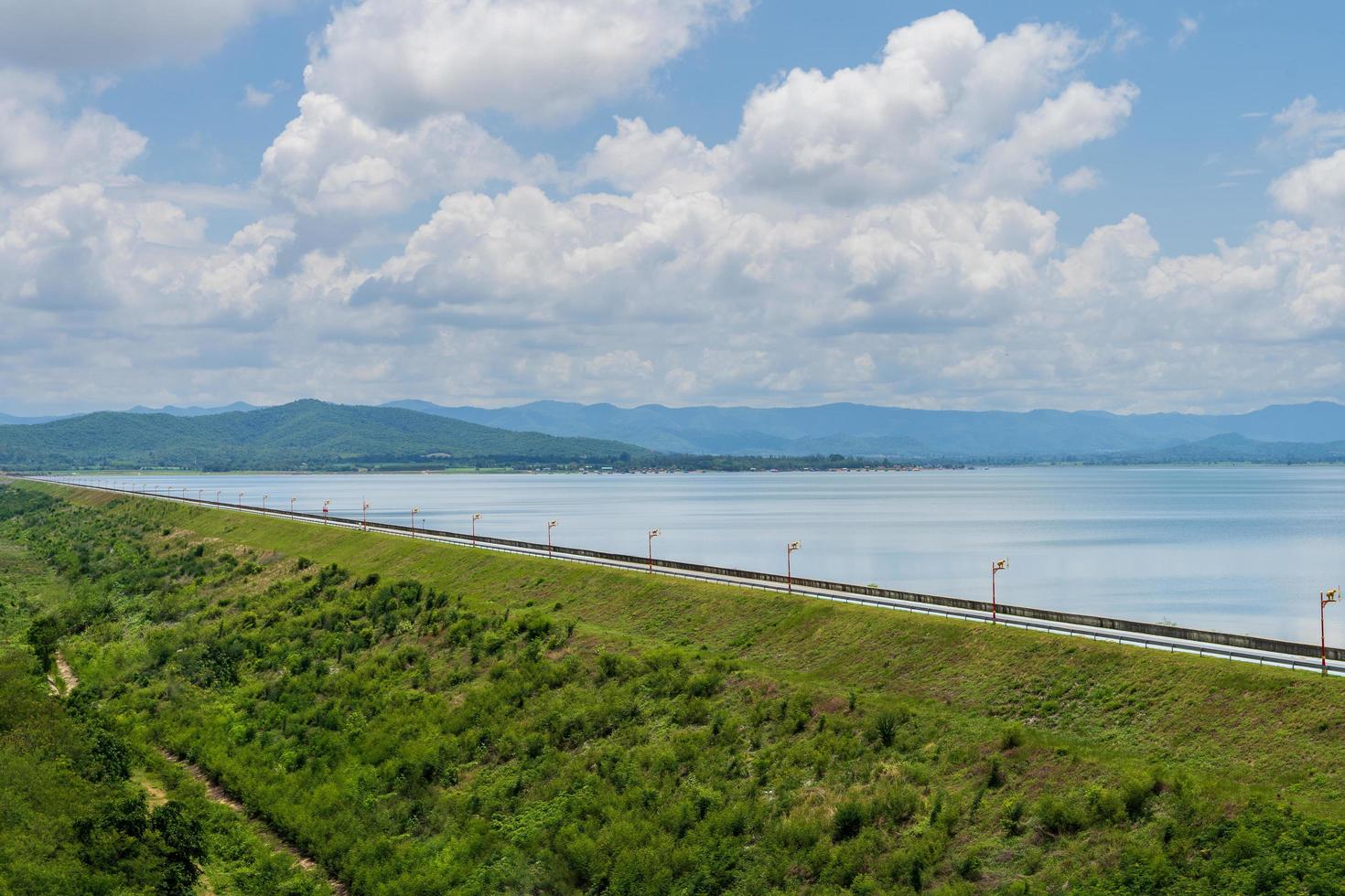 The road crosses a large reservoir dam for easy traffic and exercise. photo