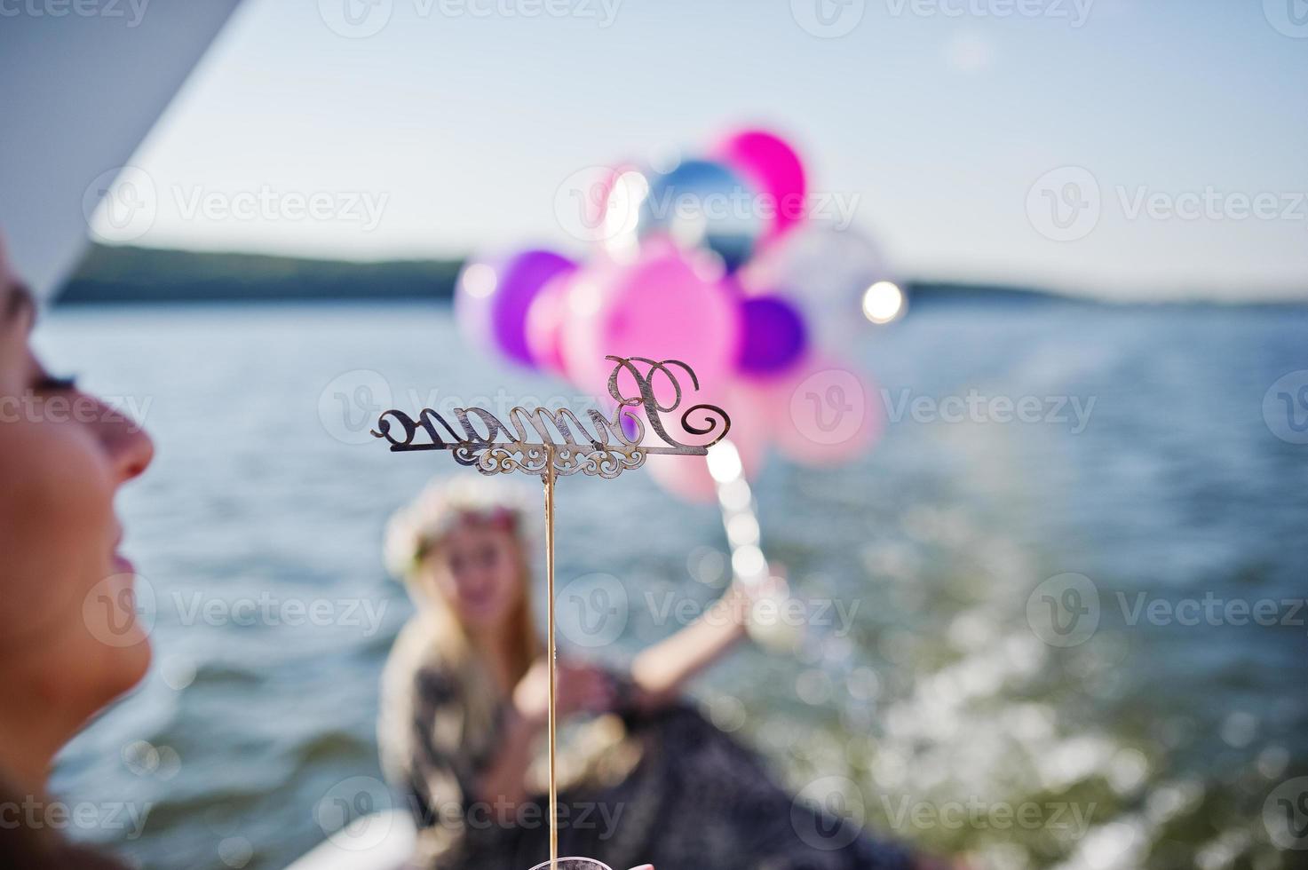Girls having fun at yacht on hen party. photo