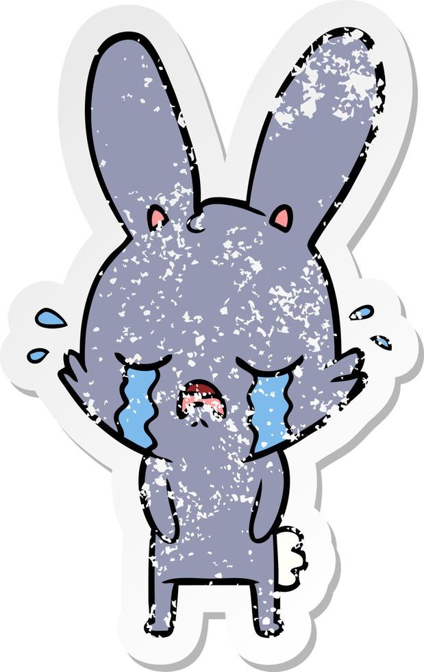 distressed sticker of a cute cartoon rabbit crying vector