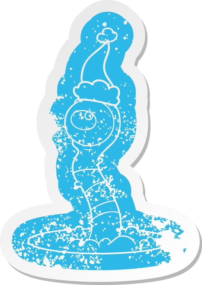 cartoon distressed sticker of a alien swamp monster wearing santa hat vector