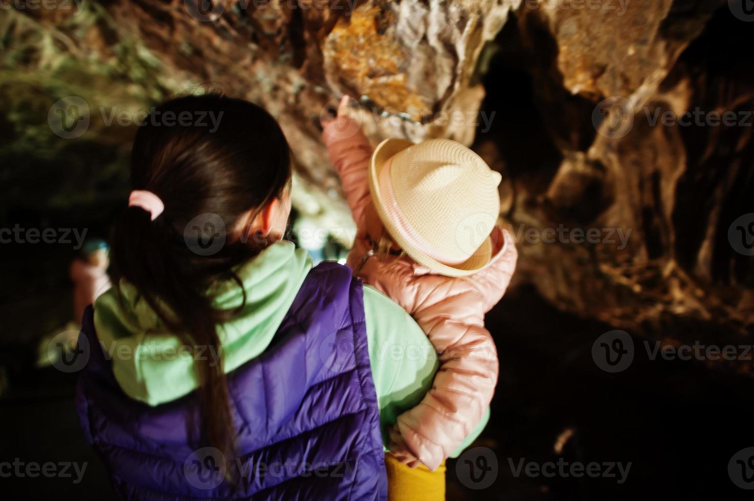 Mother with daughter explores at Punkva Caves, Czech Republic. photo