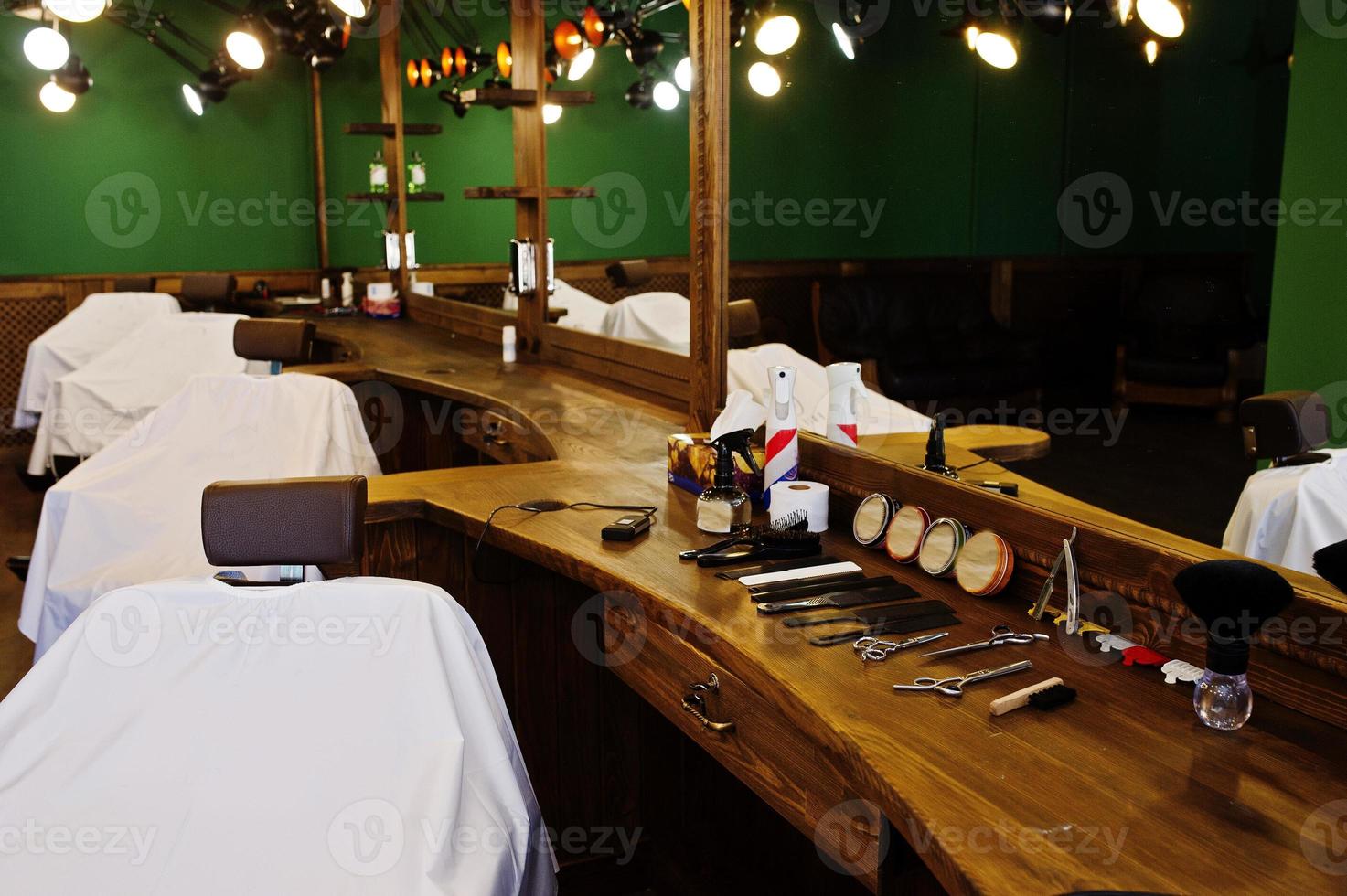 Chairs in green male barbershop in retro style. photo