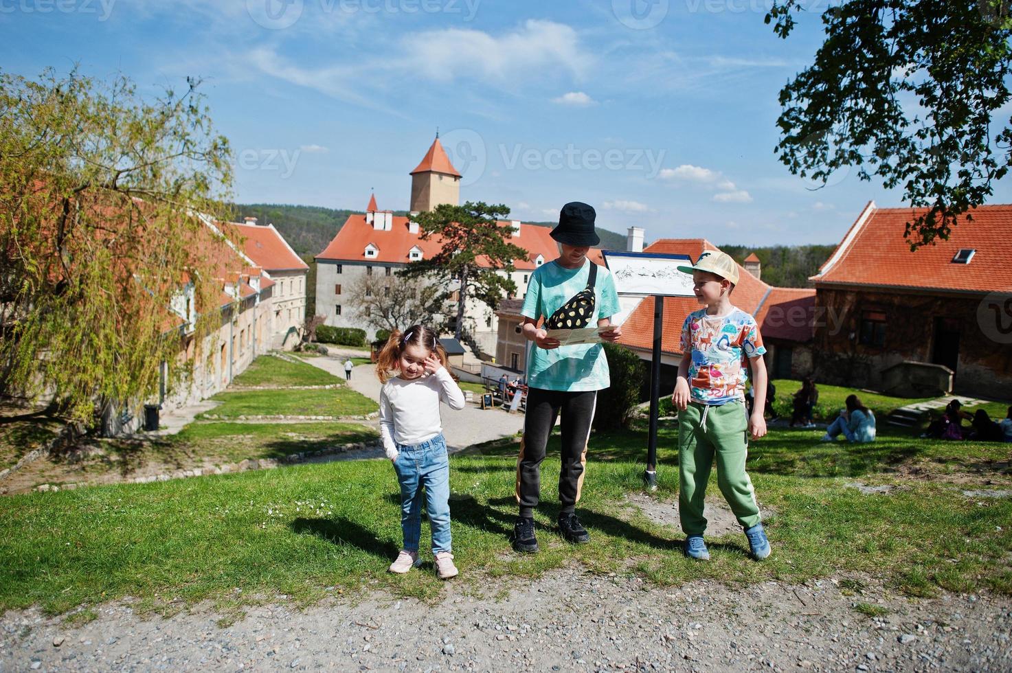 Children on a tour looking at map of Veveri castle, Czech Republic. photo