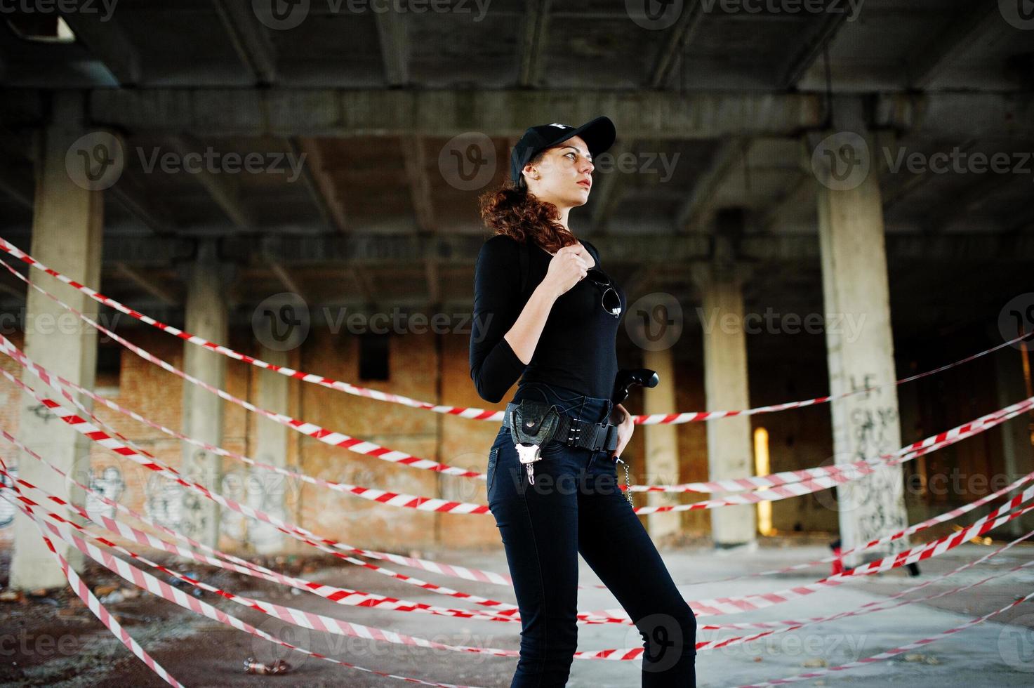 Sexy FBI female agent at abadoned place. photo