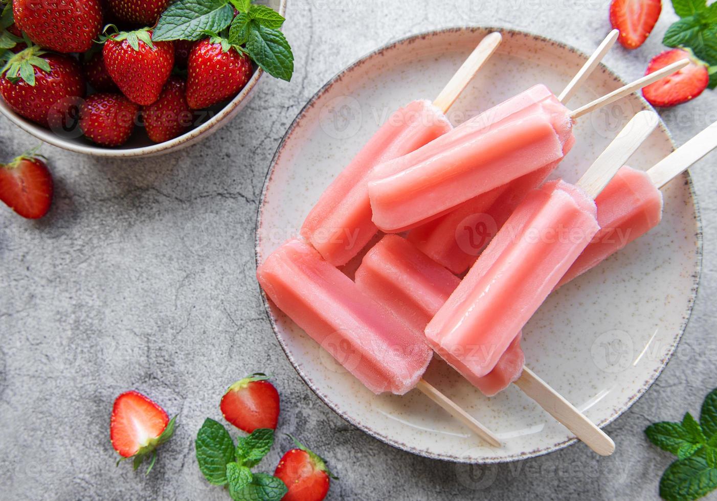 Strawberry ice cream popsicles photo