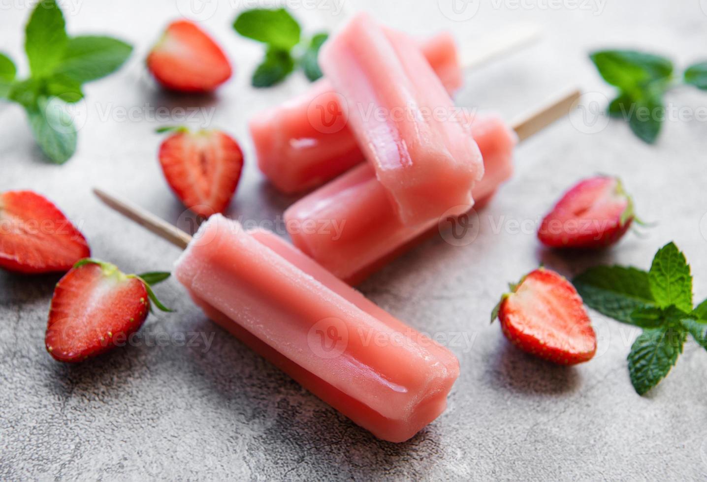 Strawberry ice cream popsicles photo