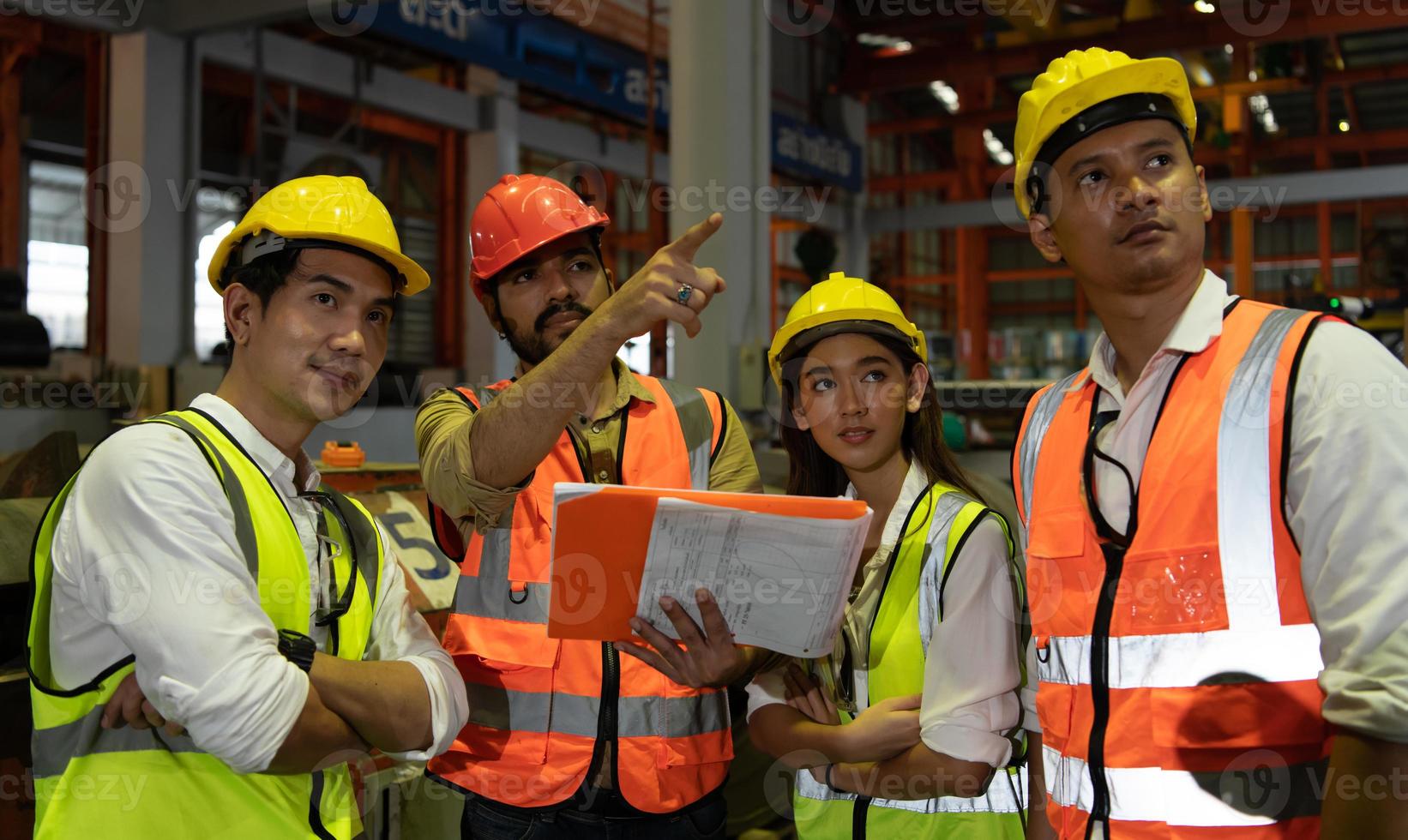 Engineering team leader Is advising the technician team and the quality inspection team. photo