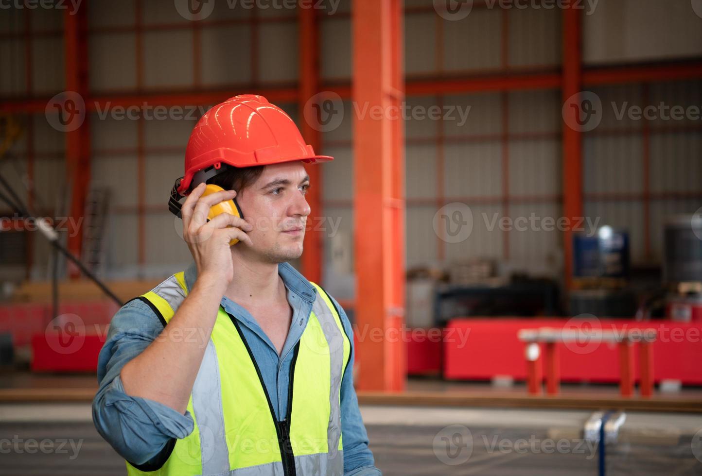 Chief mechanical engineer working in a mechanical factory Controlling machine testing in the factory photo