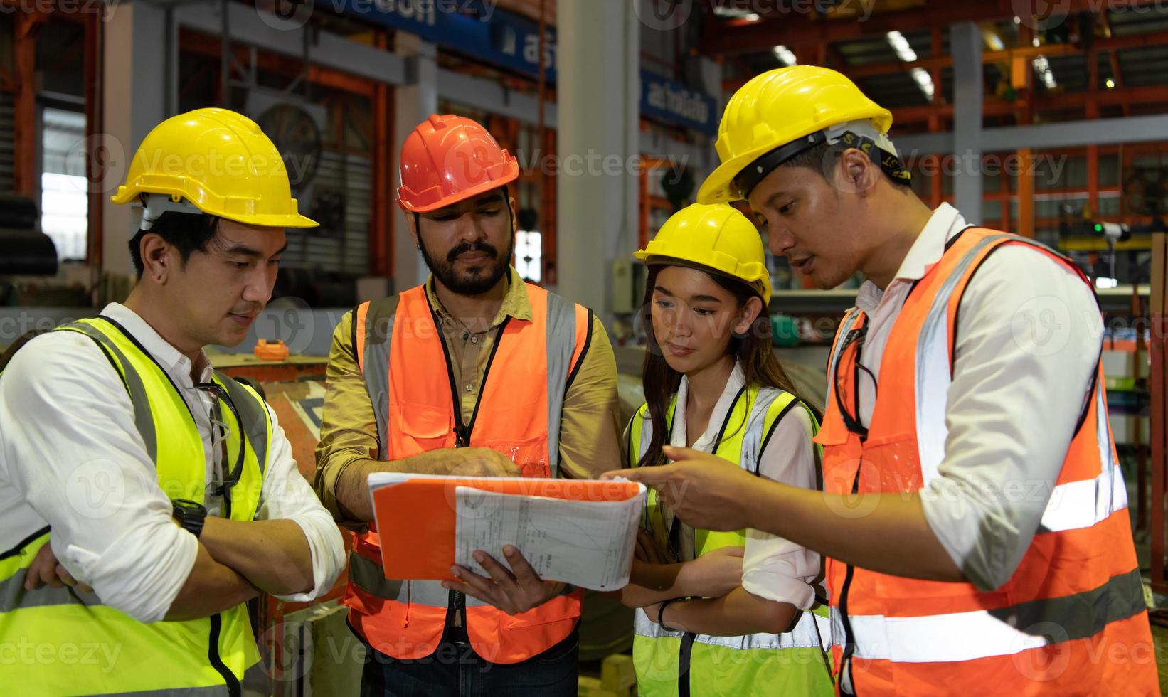 Engineering team leader Is advising the technician team and the quality inspection team. photo