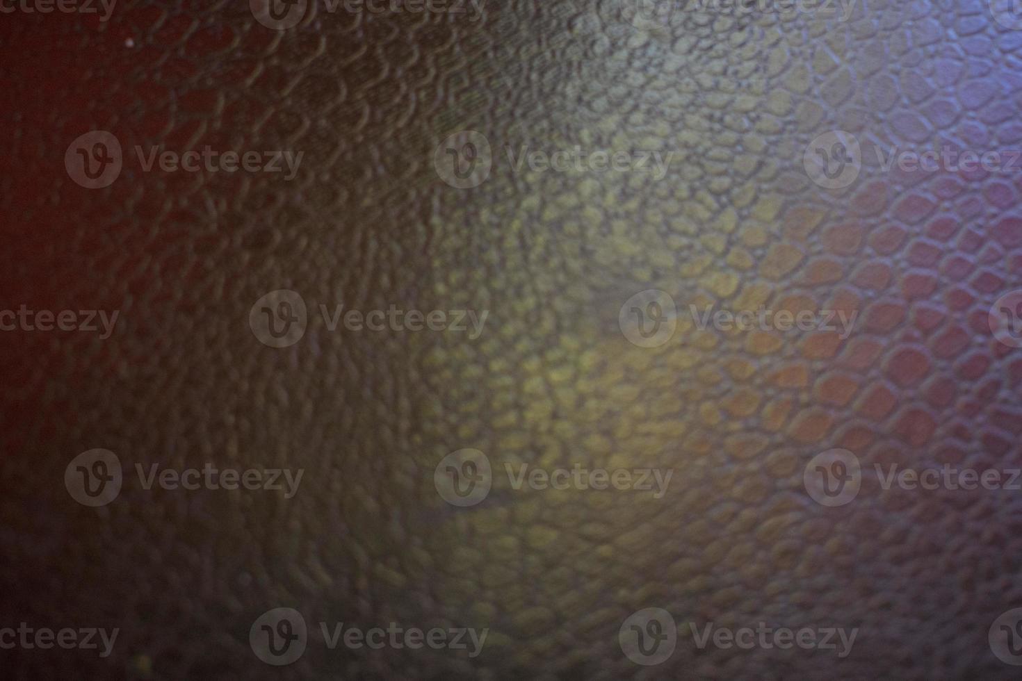 black leather background with pink and green highlight photo