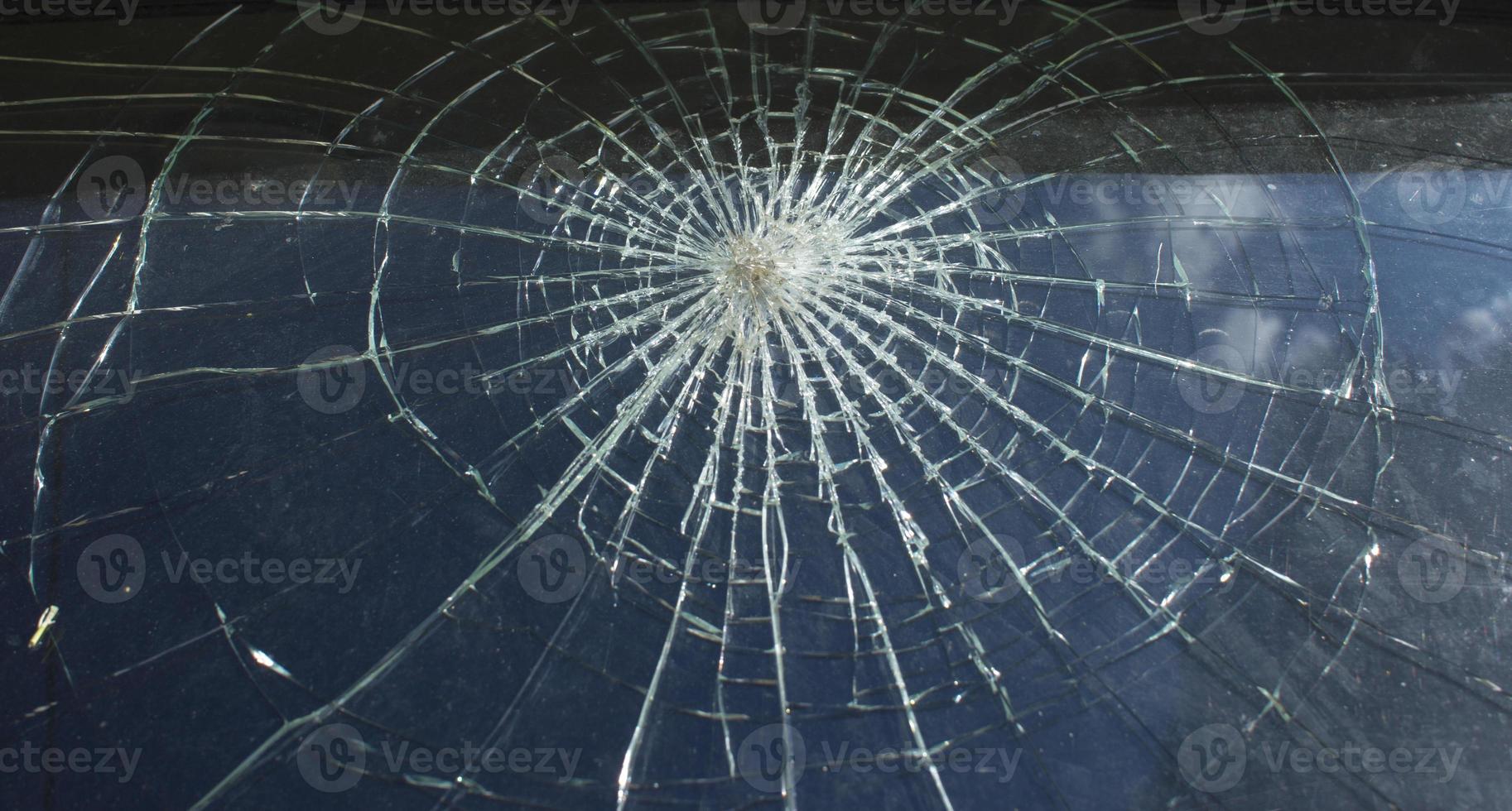 Broken glass over natural black background. photo