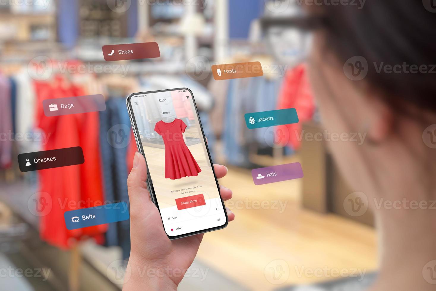 Shopping with smart phone and augmented reality app in the boutique concept. Trying on the latest clothes of different sizes and colors. Woman holding smart phone photo