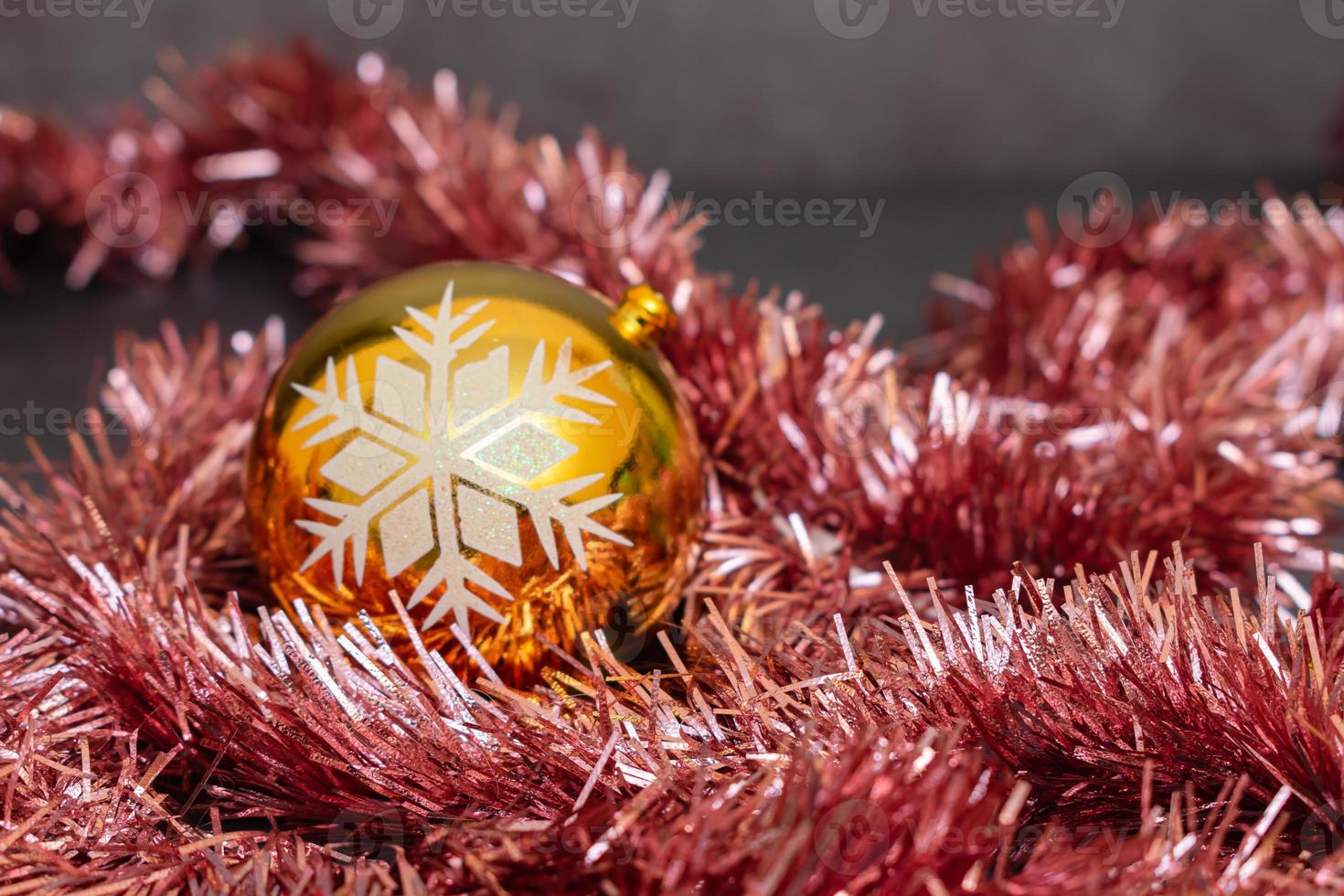 Christmas ball and tinsel in New Year's composition photo