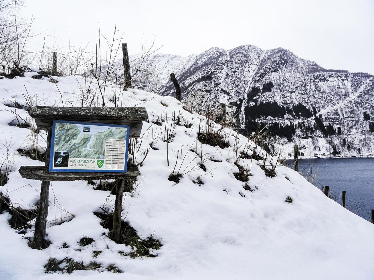 Framfjorden Vestland Norway 2015 Wooden tourist information sign in winter, Norway, Vik Kommune. photo