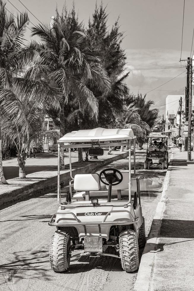 Holbox Quintana Roo Mexico 2021 Golf cart buggy cars carts muddy street village Holbox Mexico. photo