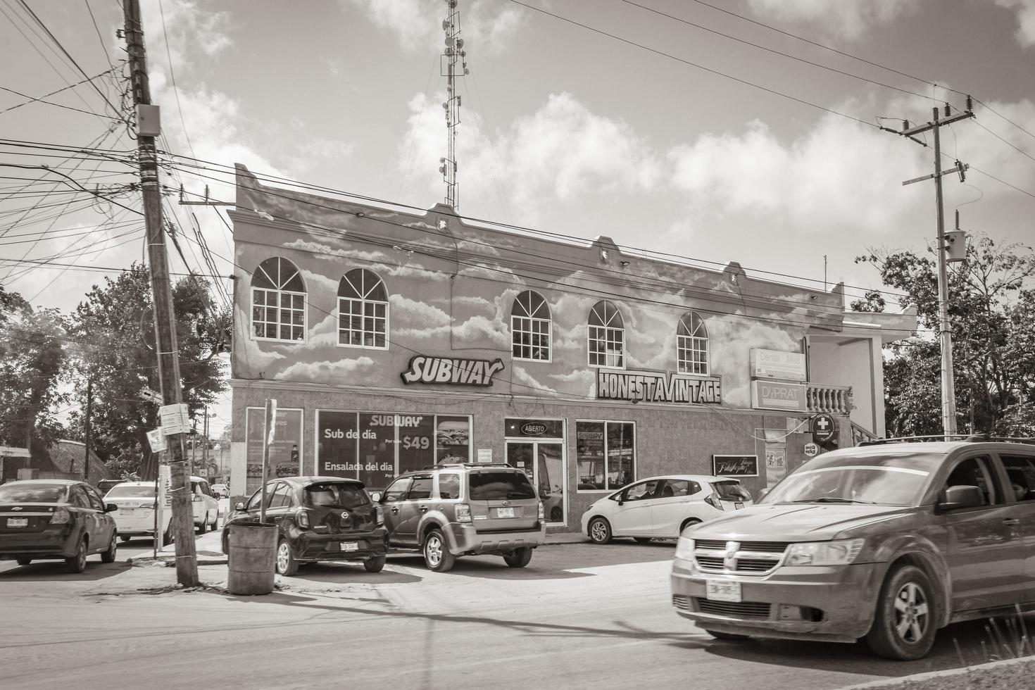 Tulum Quintana Roo Mexico 2022 Typical colorful street road traffic cars palms of Tulum Mexico. photo