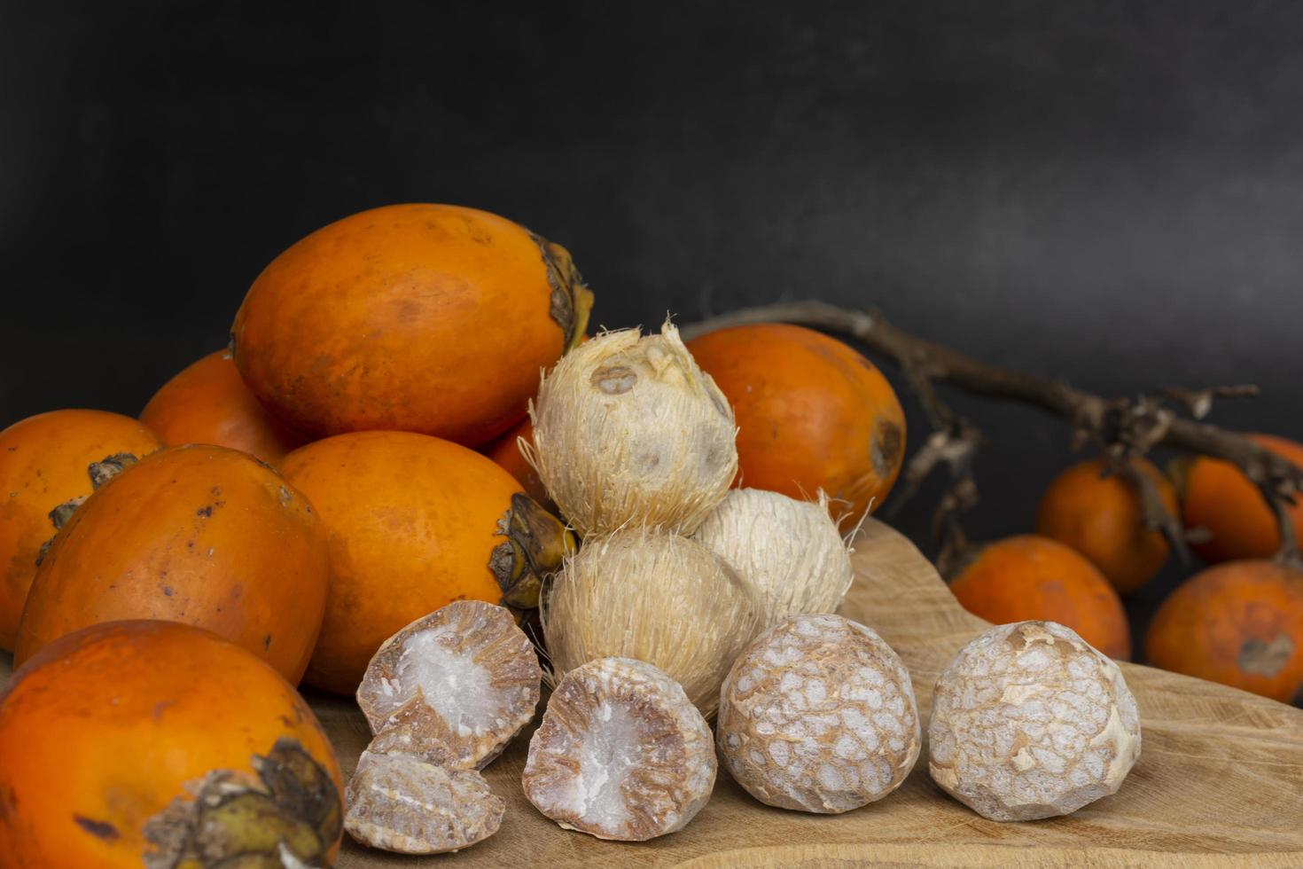 Betel nut or areca nut isolated on wooden background. photo