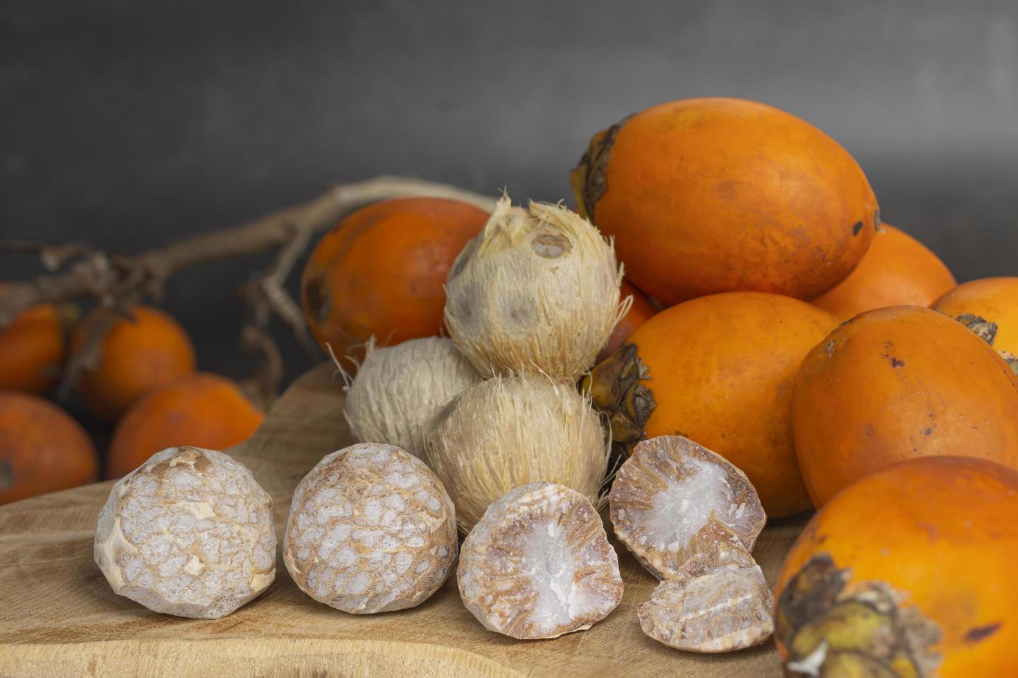 Betel nut or areca nut isolated on wooden background. photo