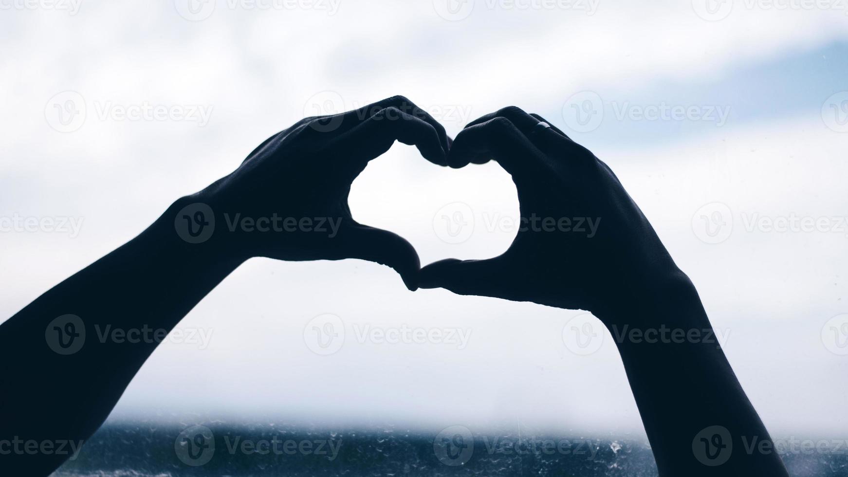 hands in the form of heart photo