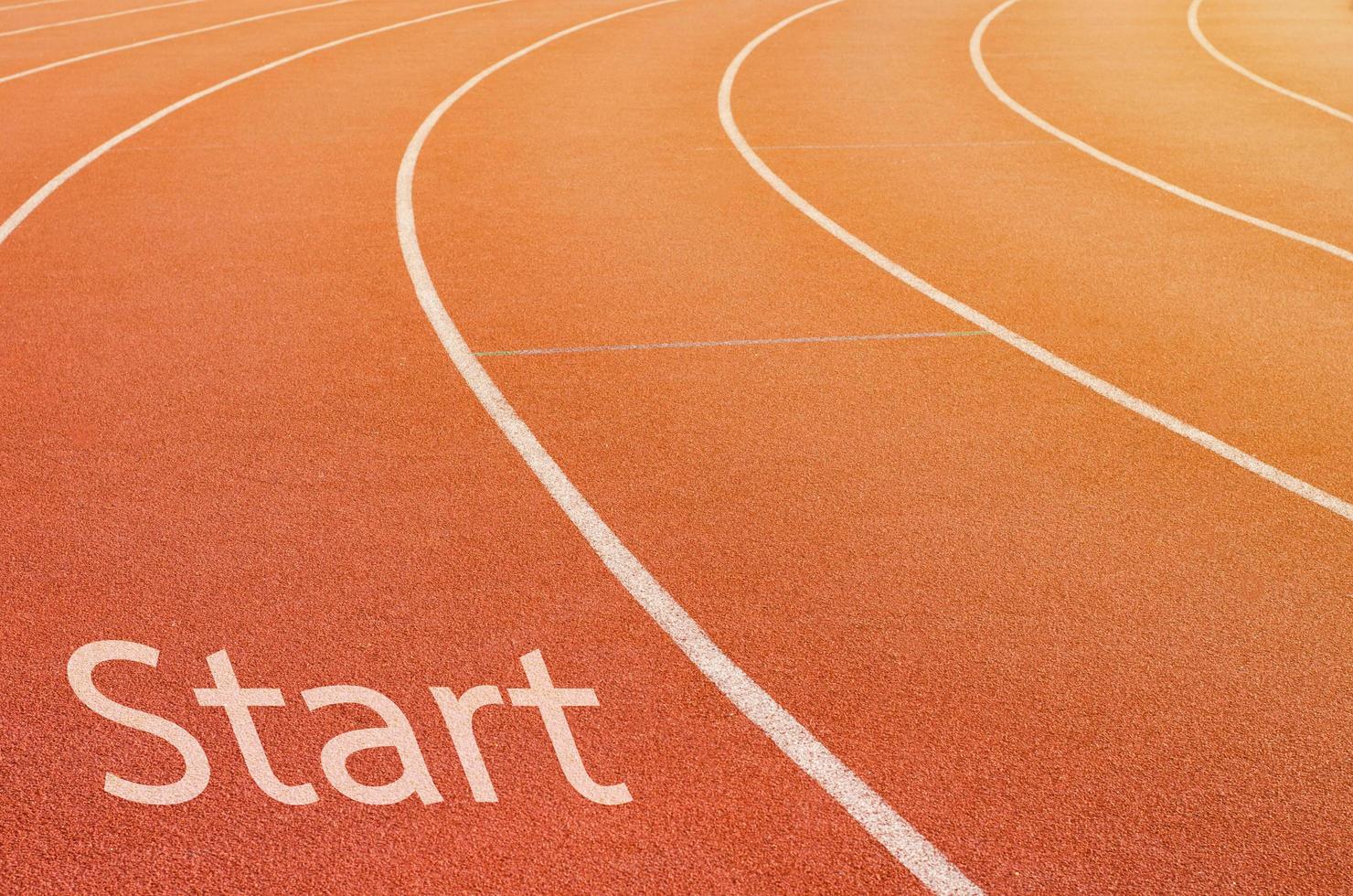 start in running track with text start photo